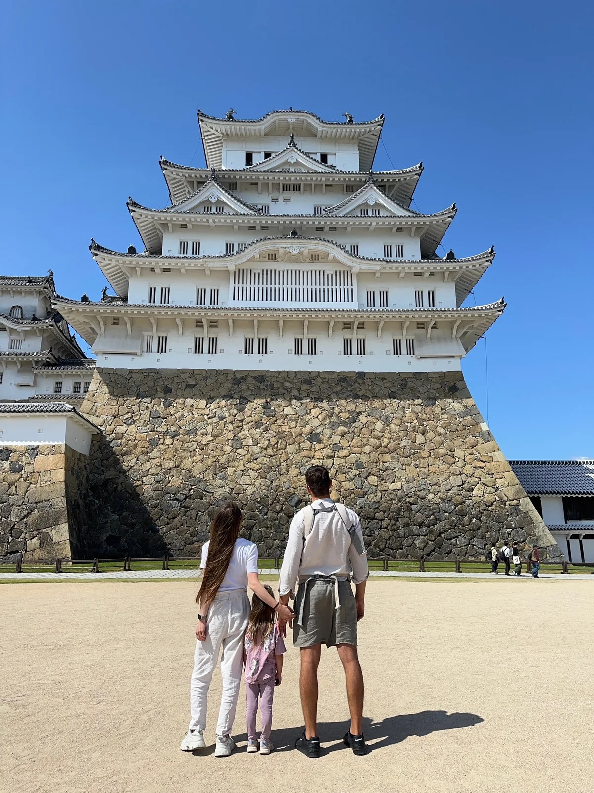 Our family seen from behind, looking towards Himeji Castle